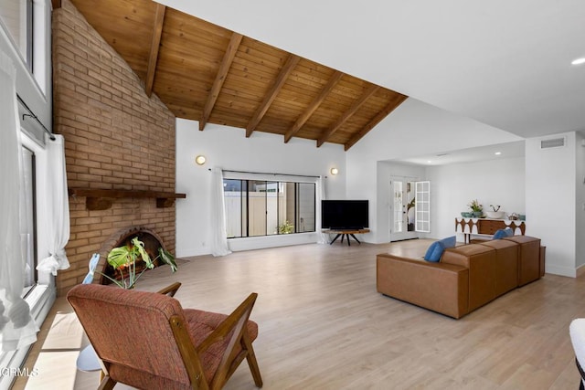 3960 W Hemlock St, Oxnard, CA 93035 - living area with high vaulted ceiling, wood ceiling, a fireplace, light wood-style floors, and beamed ceiling
