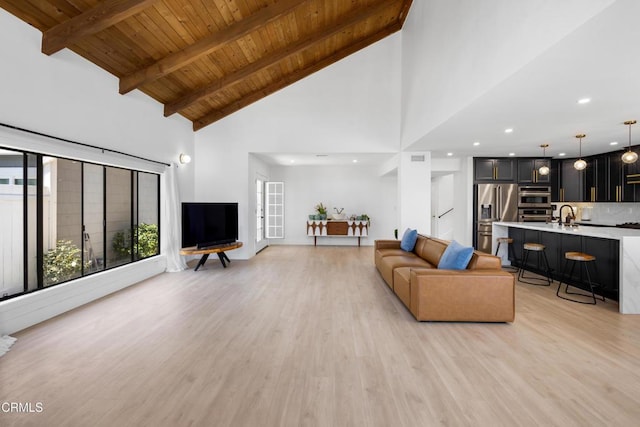 3960 W Hemlock St, Oxnard, CA 93035 - living room with high vaulted ceiling, light wood-style floors, wood ceiling, beam ceiling, and recessed lighting