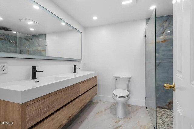 3960 W Hemlock St, Oxnard, CA 93035 - bathroom featuring walk in shower, toilet, marble finish flooring, double vanity, and baseboards