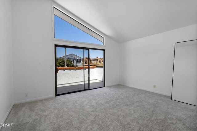 3960 W Hemlock St, Oxnard, CA 93035 - carpeted empty room with high vaulted ceiling and baseboards