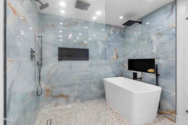 3960 W Hemlock St, Oxnard, CA 93035 - full bath with a marble finish shower, tile walls, a freestanding tub, and recessed lighting