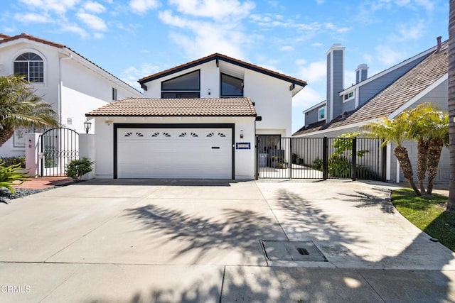 3960 W Hemlock St, Oxnard, CA 93035 - view of front of property featuring a gate, driveway, stucco siding, and a tile roof