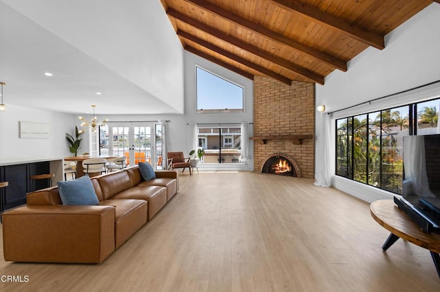 3960 W Hemlock St, Oxnard, CA 93035 - living room with a brick fireplace, a wood ceiling with exposed beams, high vaulted ceiling, healthy amount of natural light, and light wood finished floors