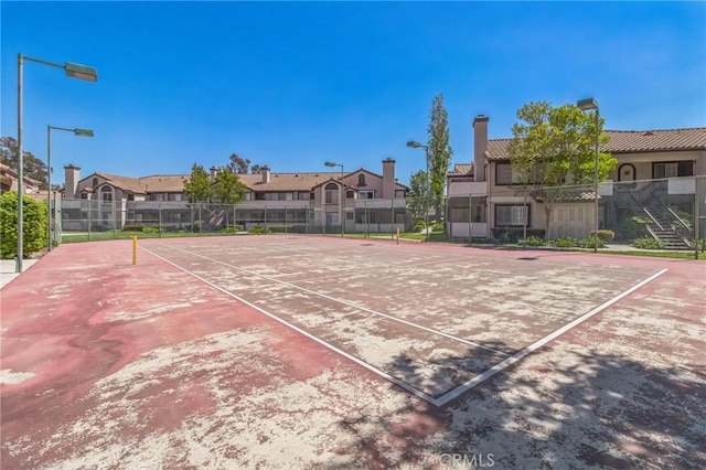 12584 Atwood Ct Unit 412, Rancho Cucamonga, CA 91739 - view of tennis court with fence and a residential view