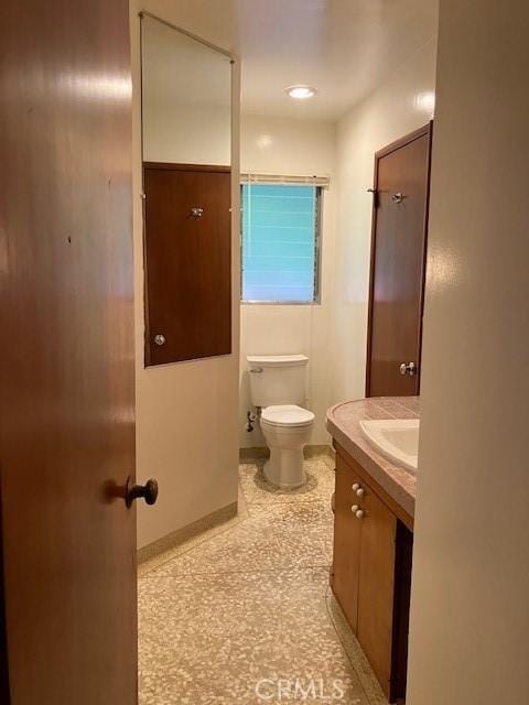 9656 Green Verdugo Dr, Shadow Hills, CA 91040 - half bath with toilet, vanity, and baseboards