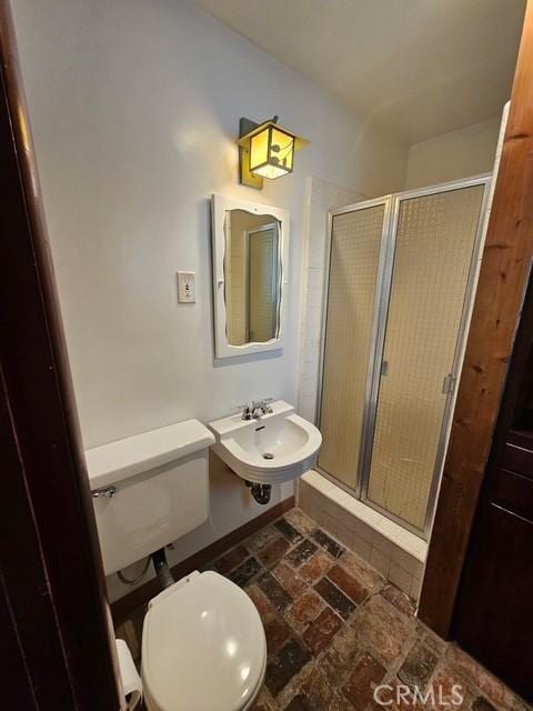 9656 Green Verdugo Dr, Shadow Hills, CA 91040 - full bath with a sink, a shower stall, toilet, and brick patterned floors