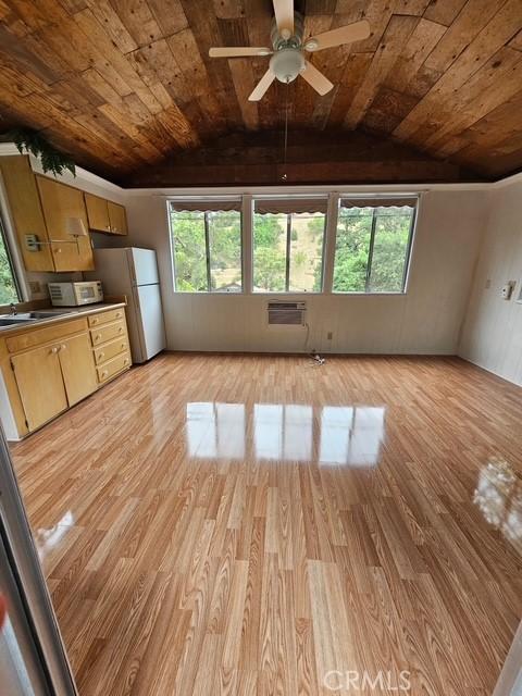 9656 Green Verdugo Dr, Shadow Hills, CA 91040 - unfurnished living room featuring wooden ceiling, light wood-style flooring, a ceiling fan, plenty of natural light, and vaulted ceiling
