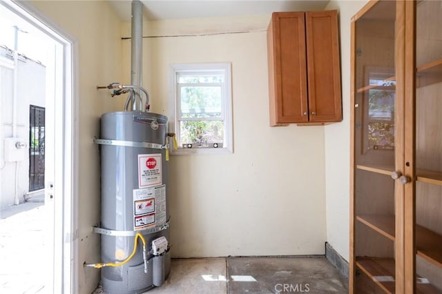 827 S Leland St, San Pedro, CA 90731 - utility room featuring secured water heater