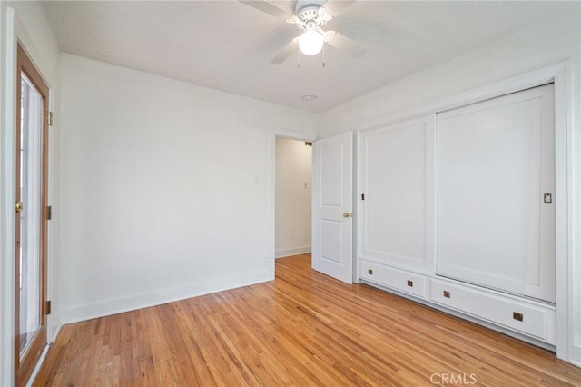 827 S Leland St, San Pedro, CA 90731 - unfurnished bedroom featuring light wood-style flooring, baseboards, a closet, and a ceiling fan