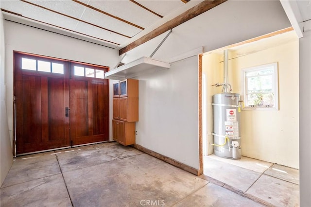 827 S Leland St, San Pedro, CA 90731 - entryway featuring secured water heater and unfinished concrete flooring