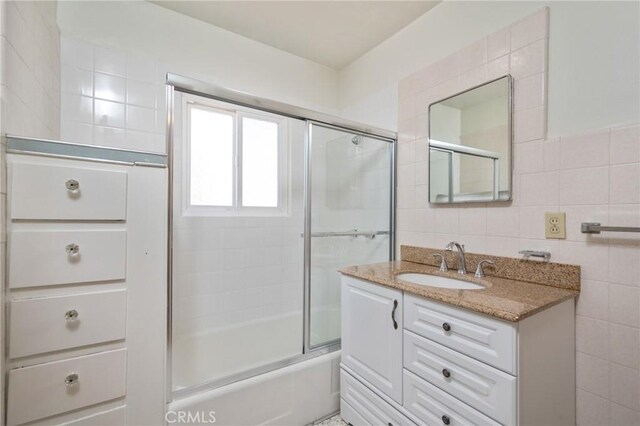 827 S Leland St, San Pedro, CA 90731 - full bath with tile walls, vanity, and combined bath / shower with glass door