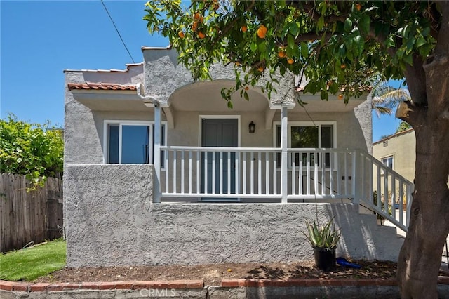 827 S Leland St, San Pedro, CA 90731 - view of front of house with stucco siding and fence