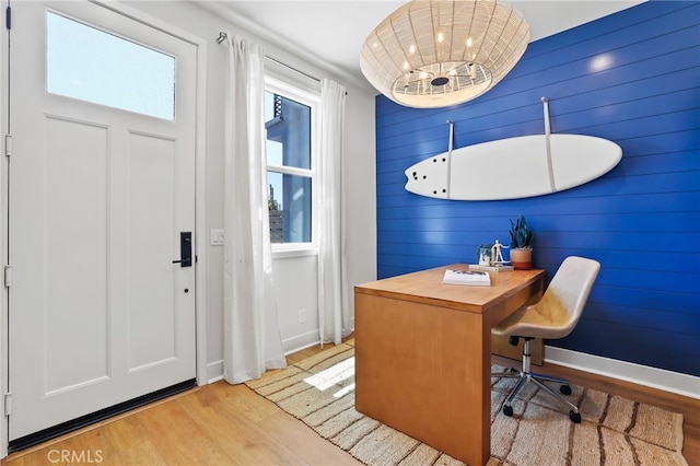 19041 Main St Unit 109, Huntington Beach, CA 92648 - office area featuring light wood-style flooring, baseboards, and wooden walls