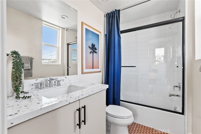 19041 Main St Unit 109, Huntington Beach, CA 92648 - full bathroom with combined bath / shower with glass door, toilet, vanity, and tile patterned flooring
