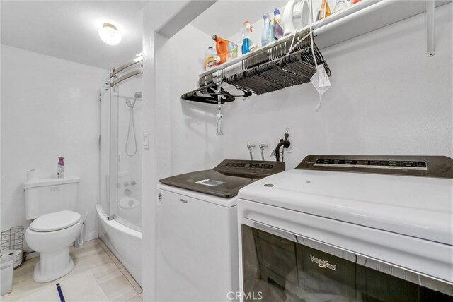 32490 Scandia Dr, Running Springs, CA 92382 - laundry room featuring washing machine and clothes dryer and light tile patterned floors