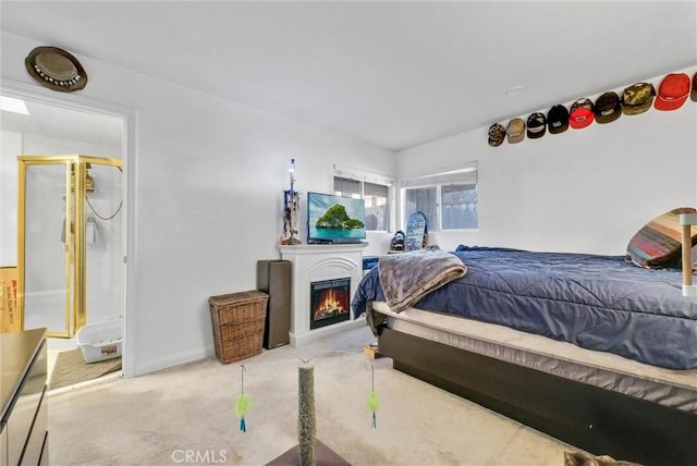 32490 Scandia Dr, Running Springs, CA 92382 - carpeted bedroom featuring a lit fireplace and baseboards