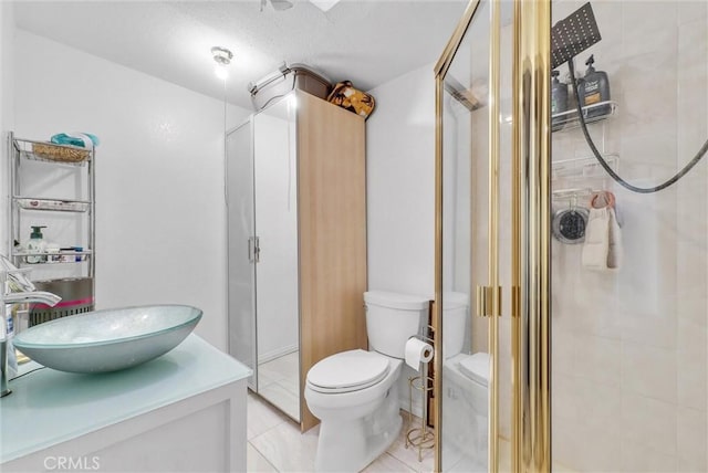 32490 Scandia Dr, Running Springs, CA 92382 - bathroom featuring toilet, a shower stall, vanity, and tile patterned flooring