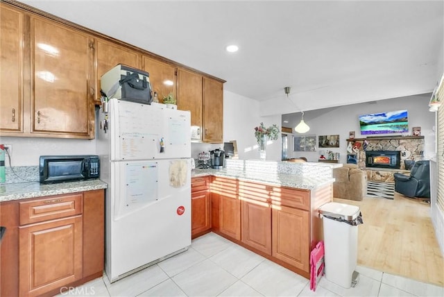 32490 Scandia Dr, Running Springs, CA 92382 - kitchen featuring freestanding refrigerator, a peninsula, brown cabinetry, open floor plan, and recessed lighting