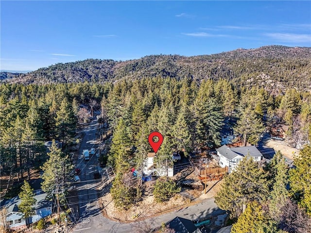 32490 Scandia Dr, Running Springs, CA 92382 - aerial overview of property's location with a heavily wooded area and a mountainous background