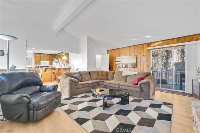 32490 Scandia Dr, Running Springs, CA 92382 - living area with wooden walls and light wood-type flooring