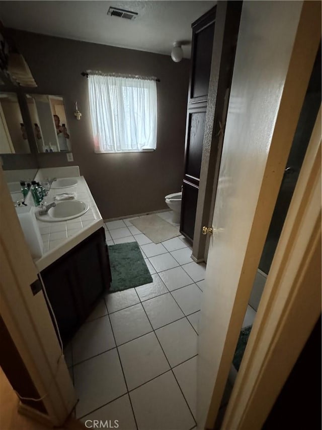 4521 Southern Breeze Dr, Bakersfield, CA 93313 - full bathroom featuring toilet, tile patterned floors, and double vanity