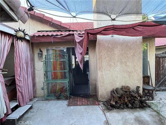 4521 Southern Breeze Dr, Bakersfield, CA 93313 - entrance to property with stucco siding, a tiled roof, and fence