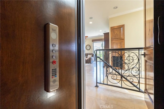 2815 Rock Wren Ln, Avila Beach, CA 93424 - corridor featuring light tile patterned floors, an upstairs landing, crown molding, and recessed lighting