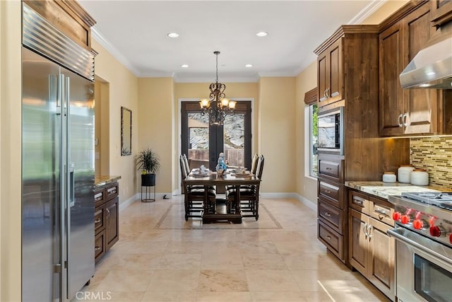 2815 Rock Wren Ln, Avila Beach, CA 93424 - kitchen with premium appliances, extractor fan, backsplash, baseboards, and a chandelier