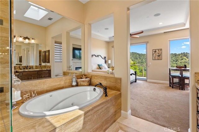 2815 Rock Wren Ln, Avila Beach, CA 93424 - full bath with a whirlpool tub, baseboards, vanity, and a skylight
