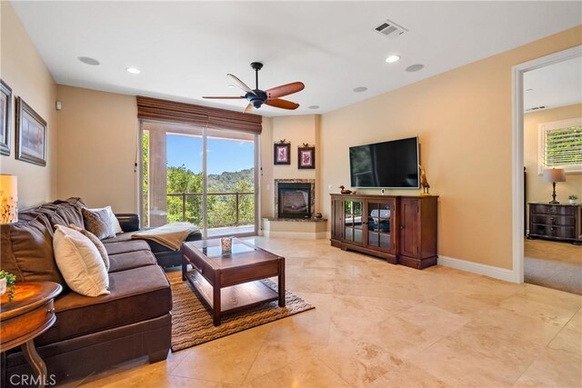 2815 Rock Wren Ln, Avila Beach, CA 93424 - living room featuring a ceiling fan, recessed lighting, baseboards, and a glass covered fireplace