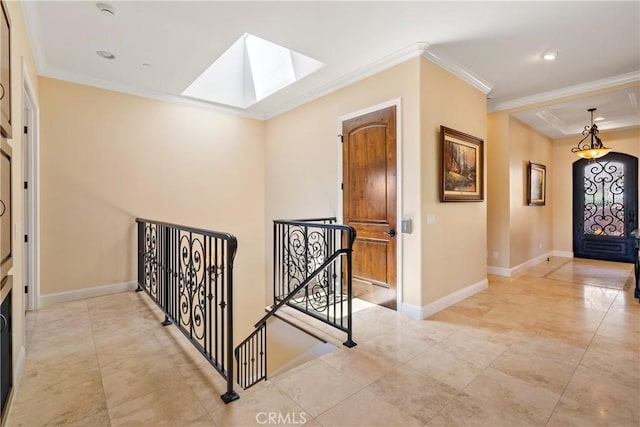 2815 Rock Wren Ln, Avila Beach, CA 93424 - corridor featuring a skylight, an upstairs landing, ornamental molding, baseboards, and light tile patterned floors