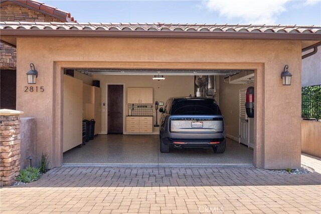 2815 Rock Wren Ln, Avila Beach, CA 93424 - garage with decorative driveway and a garage door opener