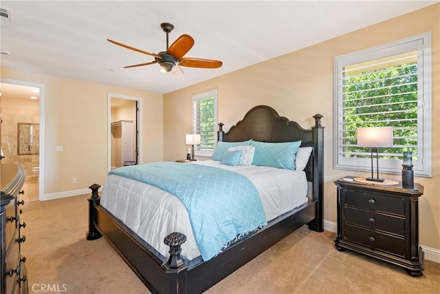 2815 Rock Wren Ln, Avila Beach, CA 93424 - carpeted bedroom with baseboards, connected bathroom, and ceiling fan