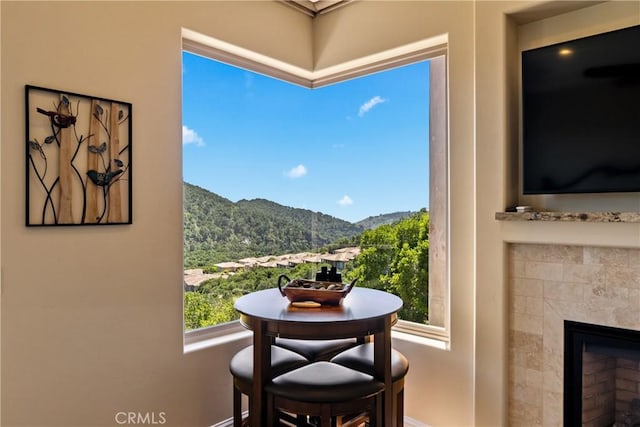 2815 Rock Wren Ln, Avila Beach, CA 93424 - dining area featuring baseboards and a tile fireplace