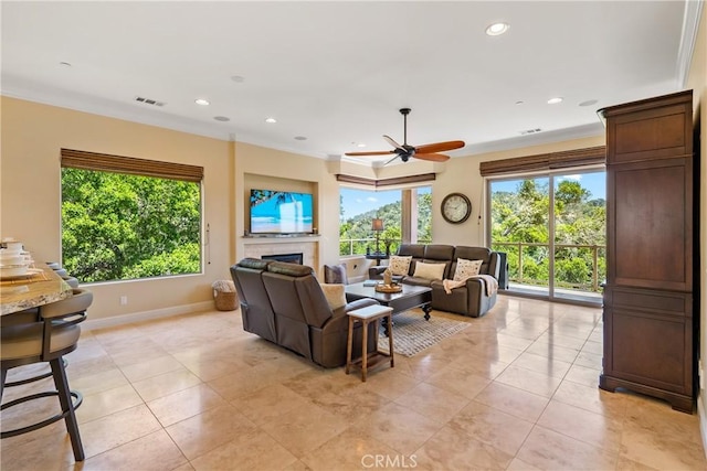 2815 Rock Wren Ln, Avila Beach, CA 93424 - living room featuring healthy amount of natural light, a ceiling fan, crown molding, a fireplace, and recessed lighting