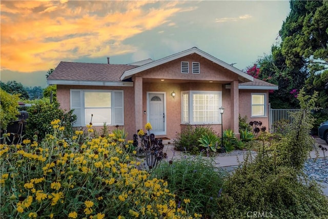 22532 Dolorosa St, Woodland Hills, CA 91367 - bungalow-style home with stucco siding, fence, and roof with shingles
