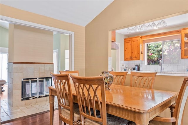 22532 Dolorosa St, Woodland Hills, CA 91367 - dining room with vaulted ceiling, wood finished floors, and a tile fireplace