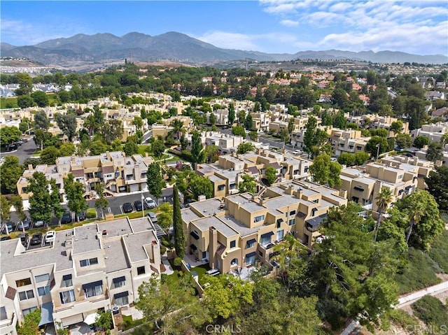 view of property location featuring a mountainous background and nearby suburban area