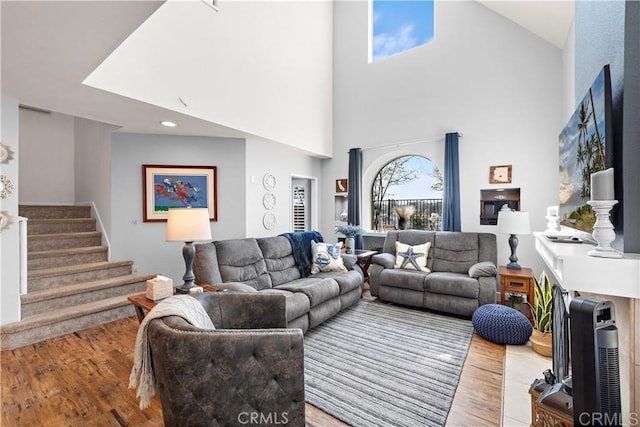 27812 Violet Unit 140, Mission Viejo, CA 92691 - living room featuring wood finished floors, stairs, and a high ceiling