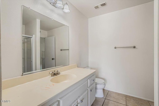 8973 Aberdare St, Ventura, CA 93004 - full bathroom featuring vanity, tile patterned floors, toilet, and a shower with door