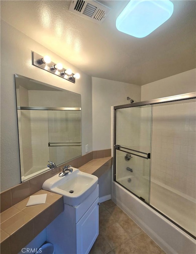 2742 Cabrillo Ave Unit 201, Torrance, CA 90501 - full bathroom with bath / shower combo with glass door, vanity, and tile patterned floors