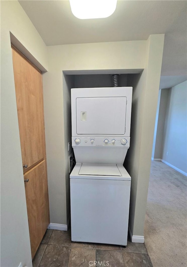 2742 Cabrillo Ave Unit 201, Torrance, CA 90501 - laundry area featuring stacked washing machine and dryer and baseboards