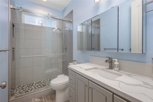 38550 Crossover Rd, Temecula, CA 92592 - bathroom featuring toilet, vanity, and a stall shower