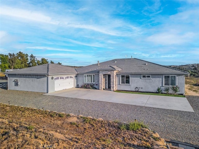 38550 Crossover Rd, Temecula, CA 92592 - ranch-style home featuring driveway, an attached garage, and stucco siding