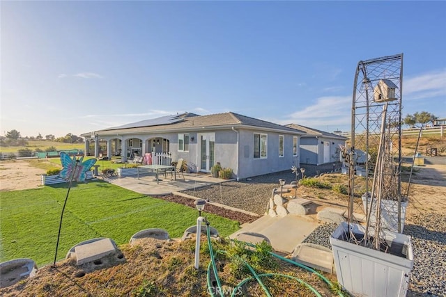 38550 Crossover Rd, Temecula, CA 92592 - back of house with a patio area, solar panels, a yard, and stucco siding