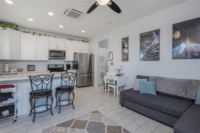38550 Crossover Rd, Temecula, CA 92592 - living area with ceiling fan, recessed lighting, and wood tiled floors