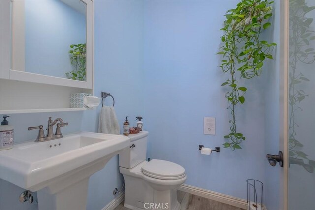 38550 Crossover Rd, Temecula, CA 92592 - bathroom featuring toilet, a sink, wood finished floors, and baseboards