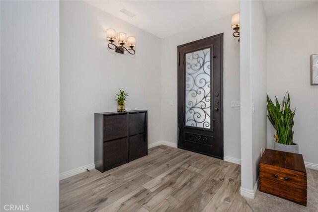 38550 Crossover Rd, Temecula, CA 92592 - foyer featuring light wood finished floors, baseboards, and a chandelier