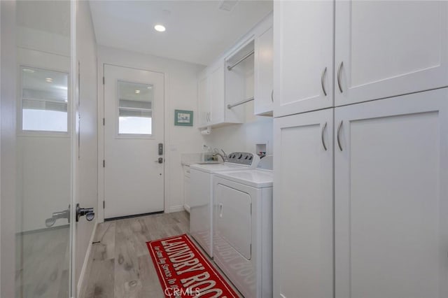 38550 Crossover Rd, Temecula, CA 92592 - washroom featuring cabinet space, light wood-style floors, and independent washer and dryer