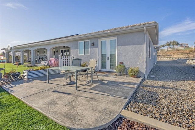 38550 Crossover Rd, Temecula, CA 92592 - back of house with french doors, a patio area, outdoor dining space, and stucco siding